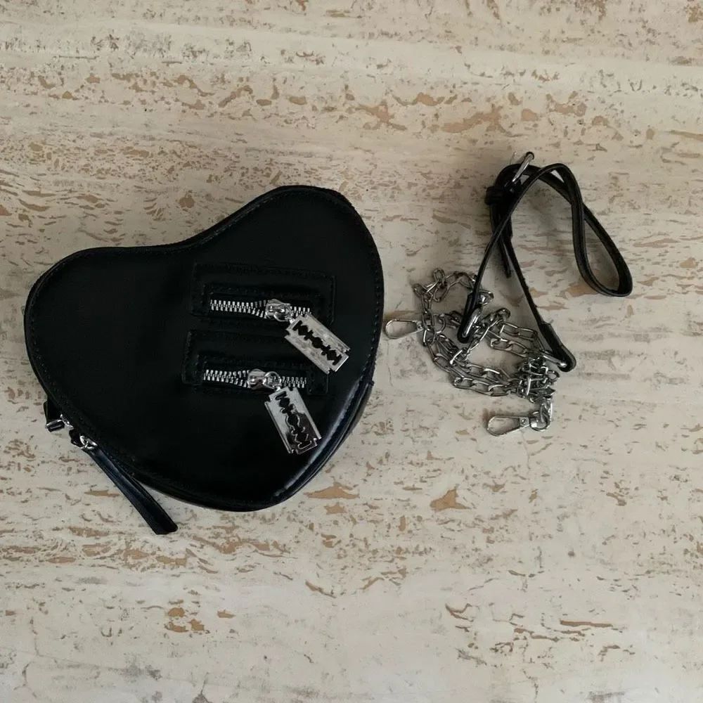 New Heart cross body with razor zips faux leather